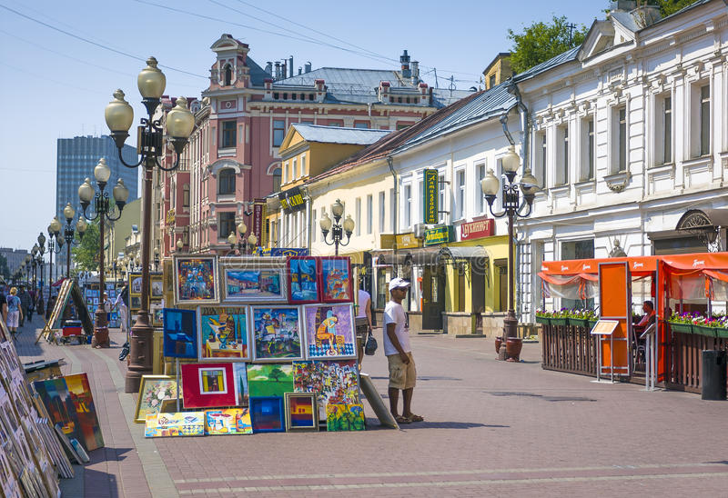 famous-pedestrian-arbat-street-moscow-russia-may-artists-sell-paintings-to-tourists-market-52513561